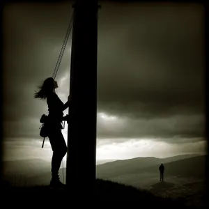 Swinging Silhouette at Sunset on Beach