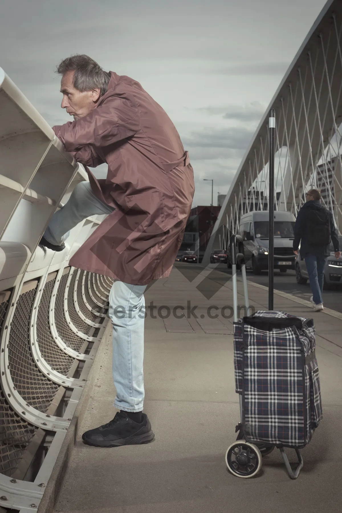 Picture of Man using device with shopping basket.