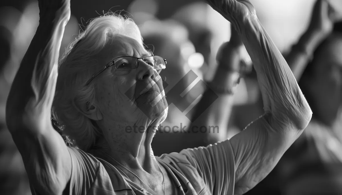 Picture of Elderly man observing the world at statue.