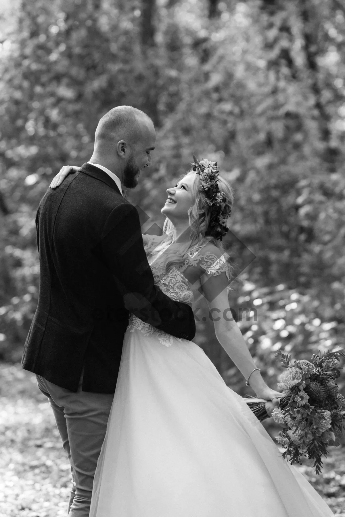 Picture of Happy couple celebrating love with a wedding bouquet.