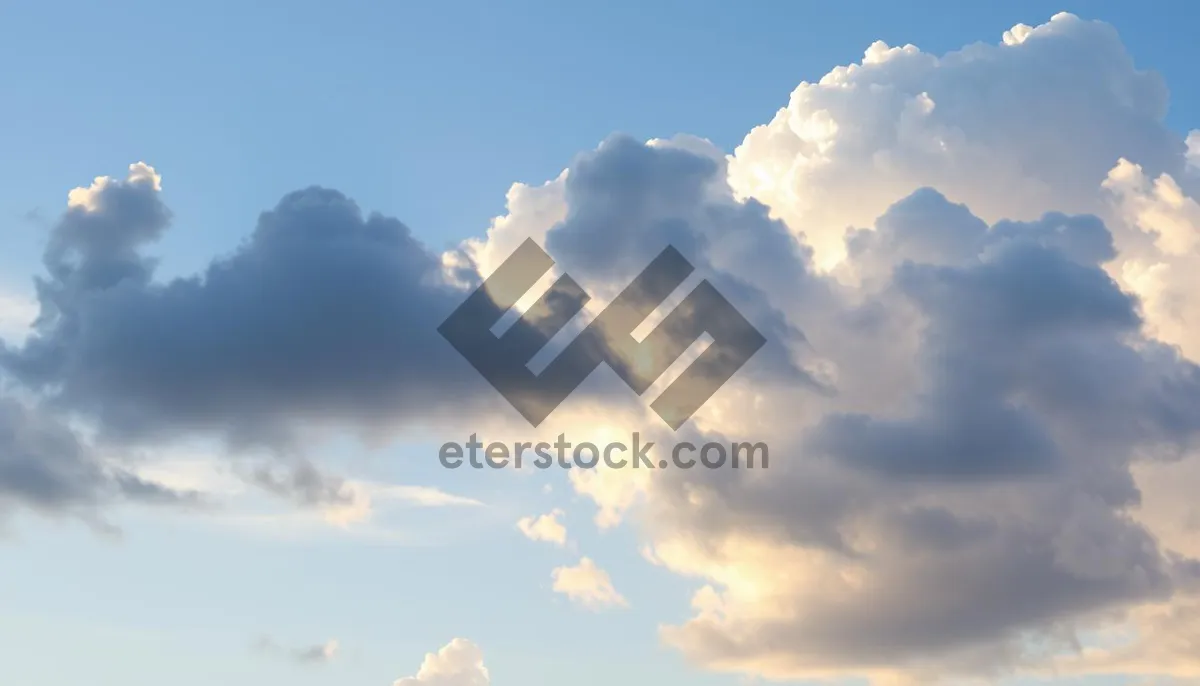 Picture of Summer Sky with Fluffy Clouds and Bright Sun