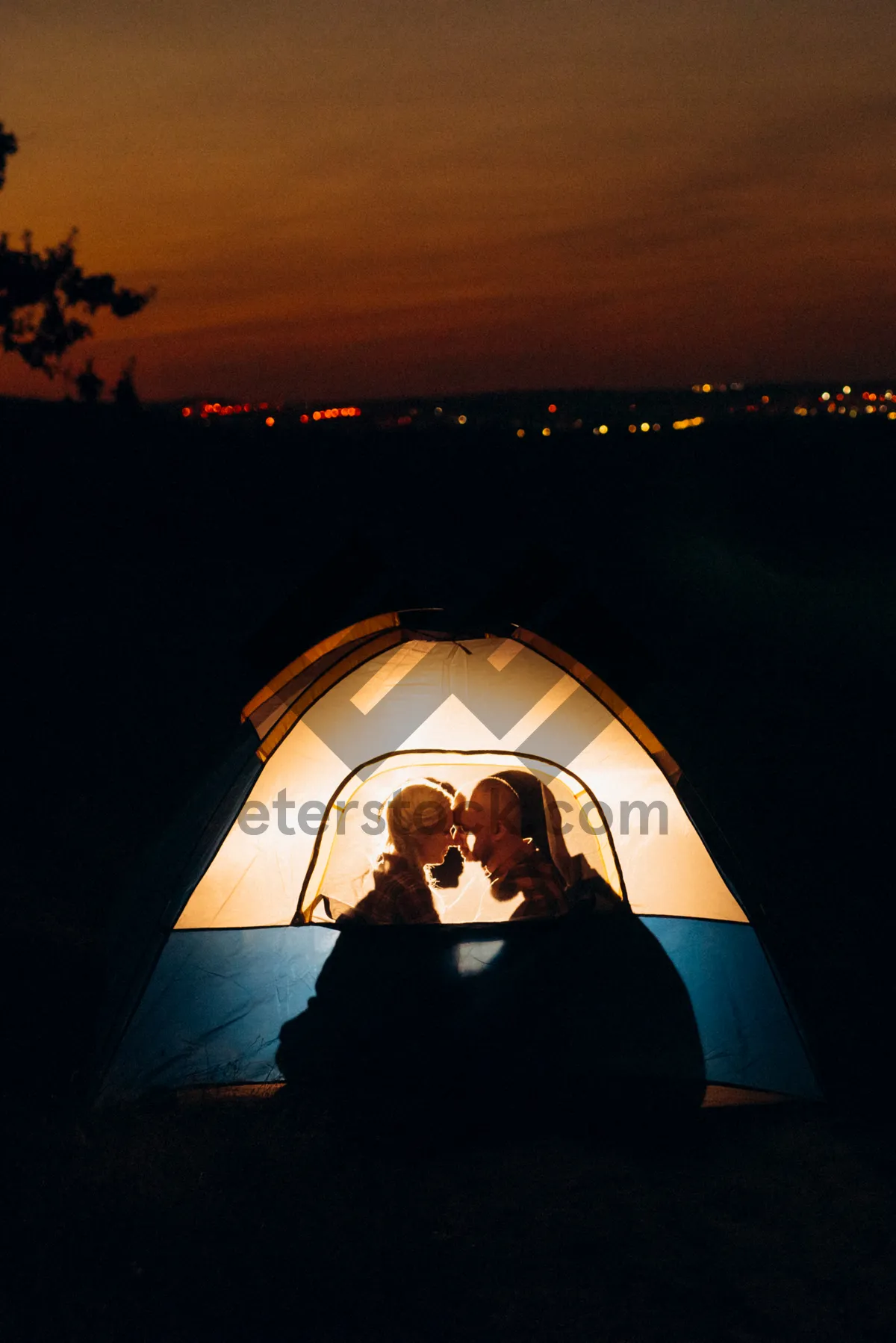 Picture of Silhouette tent against mountain backdrop.