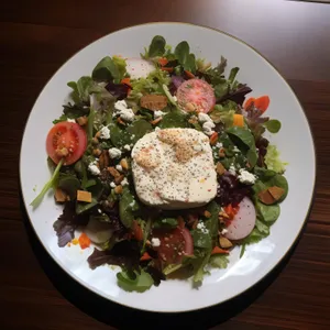 Fresh gourmet vegetable salad with grilled meat slice.