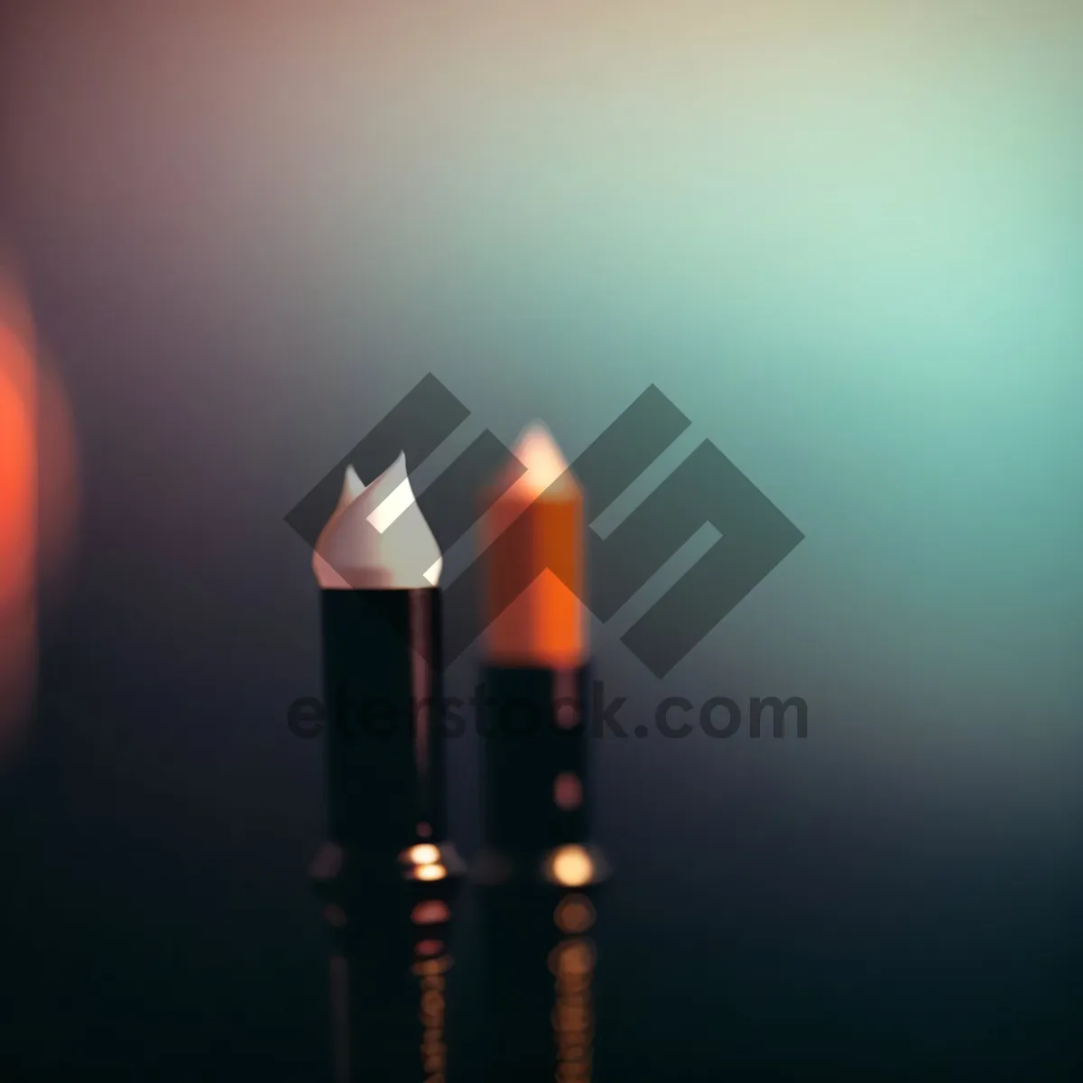 Picture of Colorful Lipstick, Pencil, and Flame