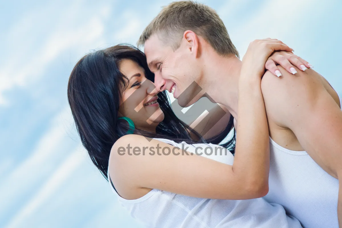 Picture of Happy couple smiling outdoors in love and happiness.