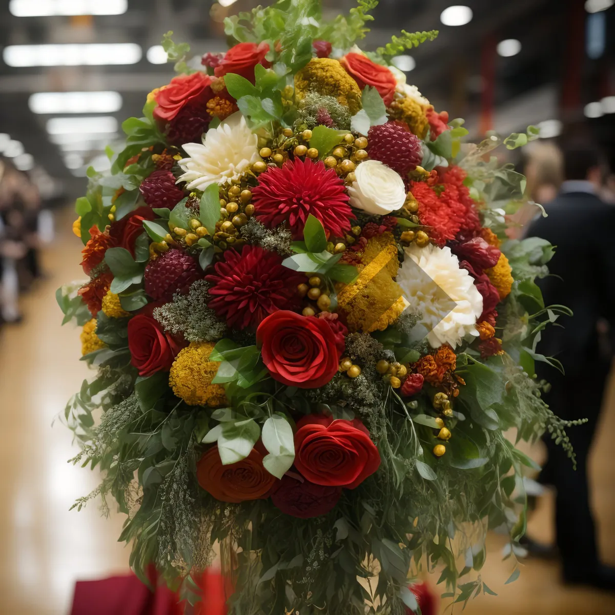 Picture of Festive holiday flower arrangement with ornaments and ribbon