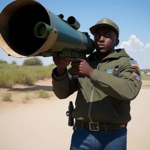 Military Man with Binoculars and Rifle