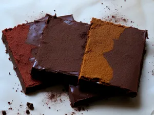 Delicious chocolate cake slice on brown plate