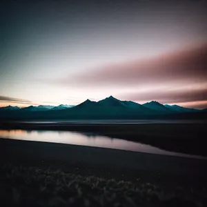 Golden Horizon: Majestic Sunset over Desert Landscape