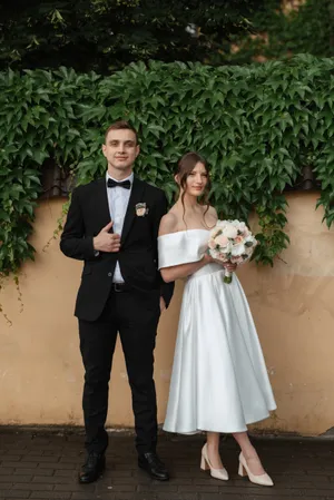 Smiling groom and bride celebrating their love outdoors