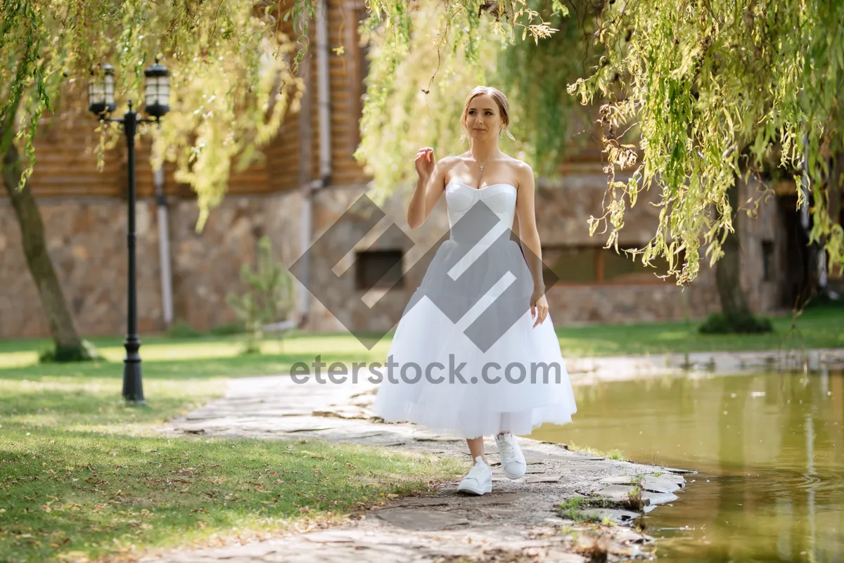 Picture of Happy Bride and Groom Posing Outdoors