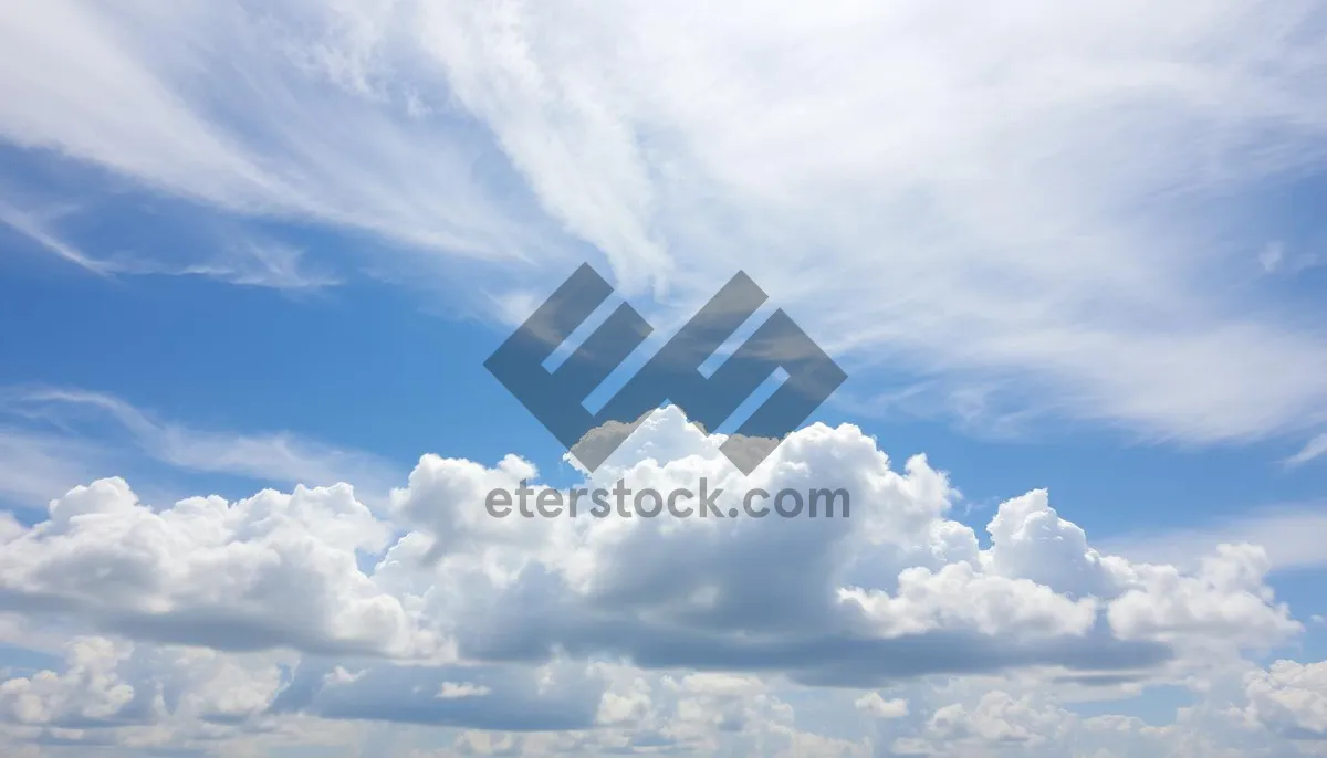 Picture of Vibrant sunny sky with fluffy clouds.