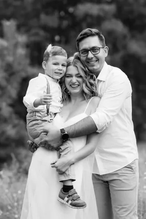 Happy family portrait in the park outdoor setting.