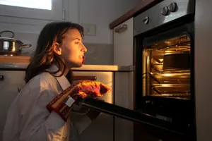 Happy people cooking in a cozy kitchen.