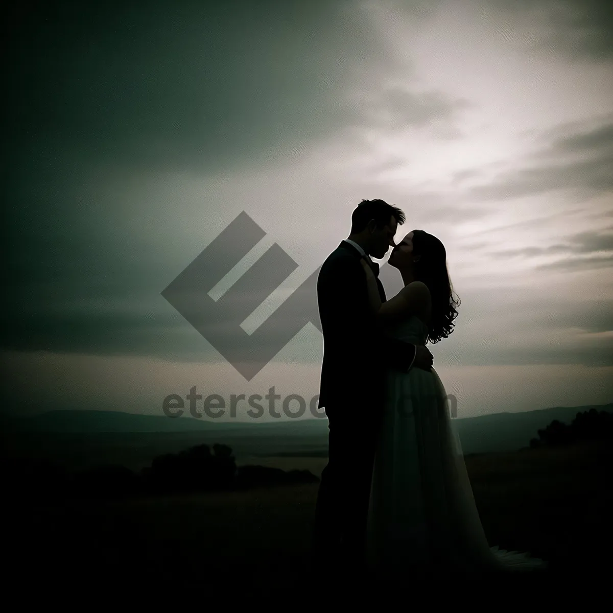 Picture of Sunset Lovebirds: Newlywed Couple Embracing in Romantic Sky