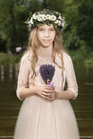 Smiling lady model in embroidered dress at the park