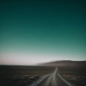 Sunset Desert Highway: Tranquil Scenic Landscape under Open Sky