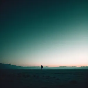 Golden Horizon: Tranquil Valley Under Clear Skies
