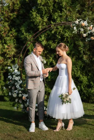 Happy groom and bride smiling on wedding day