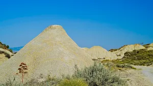 Ancient Pyramid in Desert Landscape at Sunset