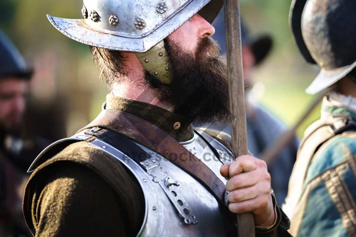 Picture of Male soldier in protective armor with gun