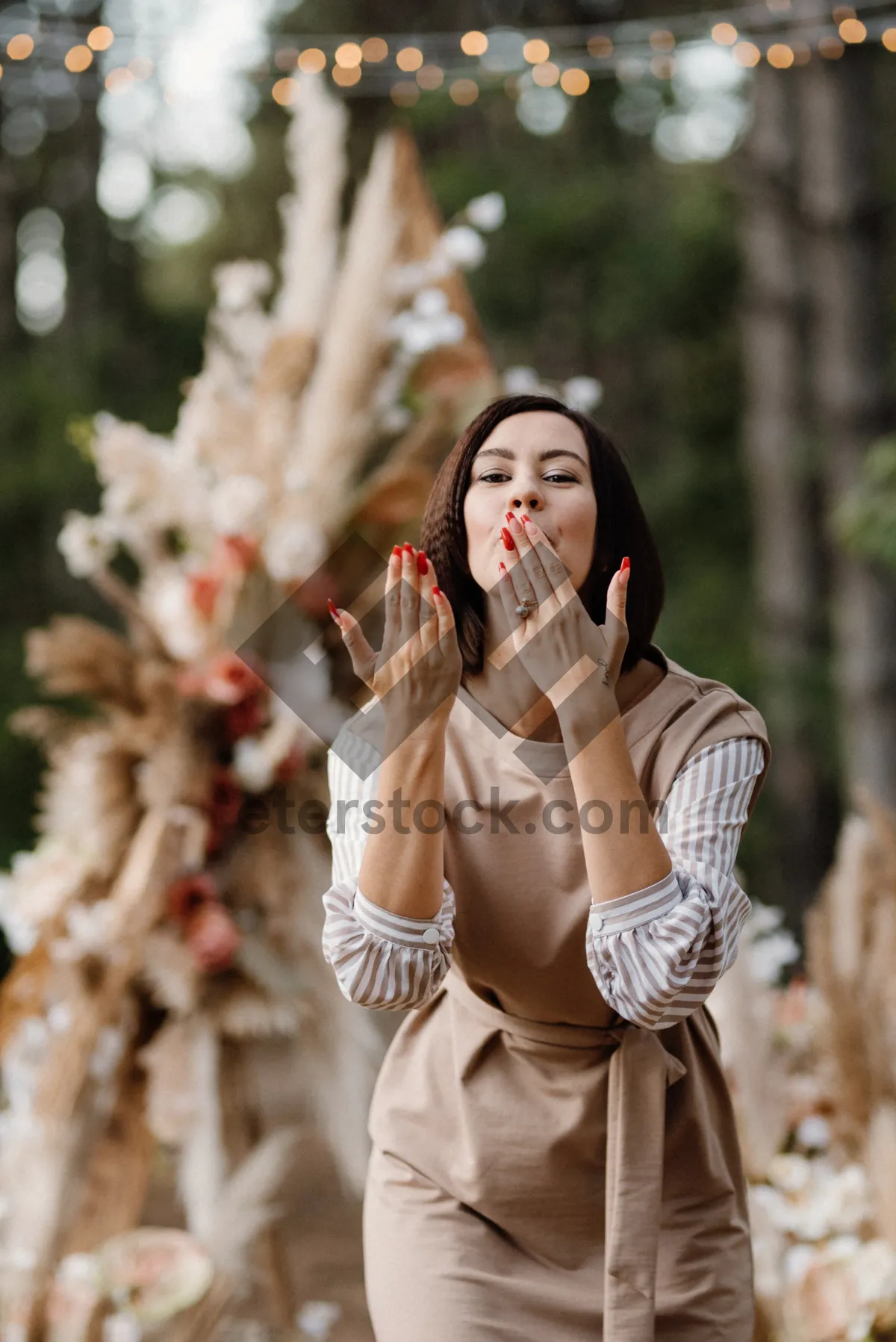 Picture of Happy woman with phone in park