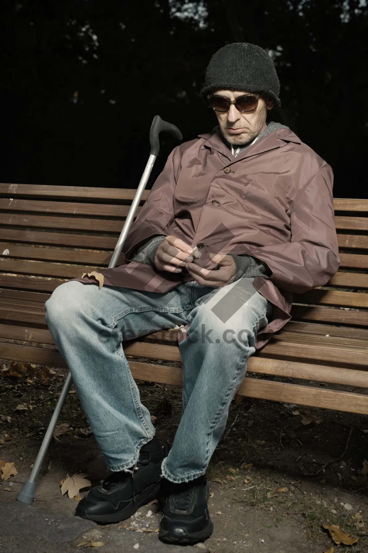 Picture of Man sitting on park bench outdoors