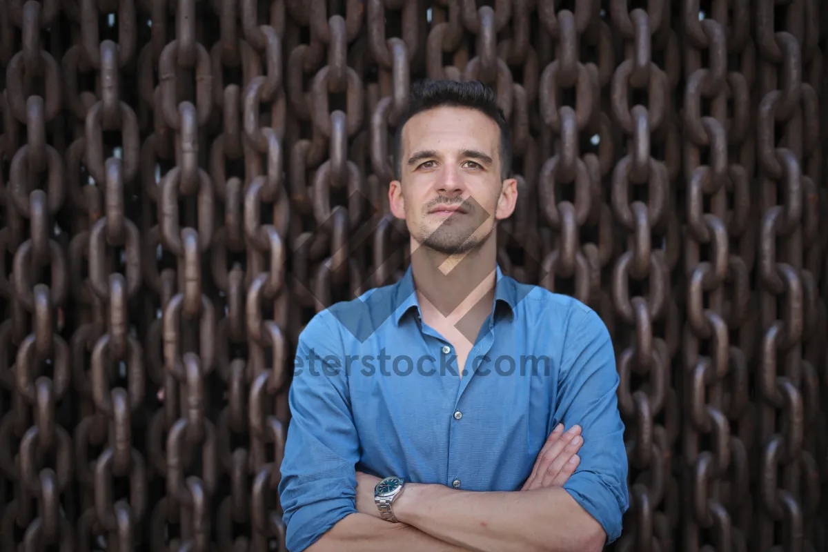 Picture of Happy businessman in modern corporate suit, confident and smiling.