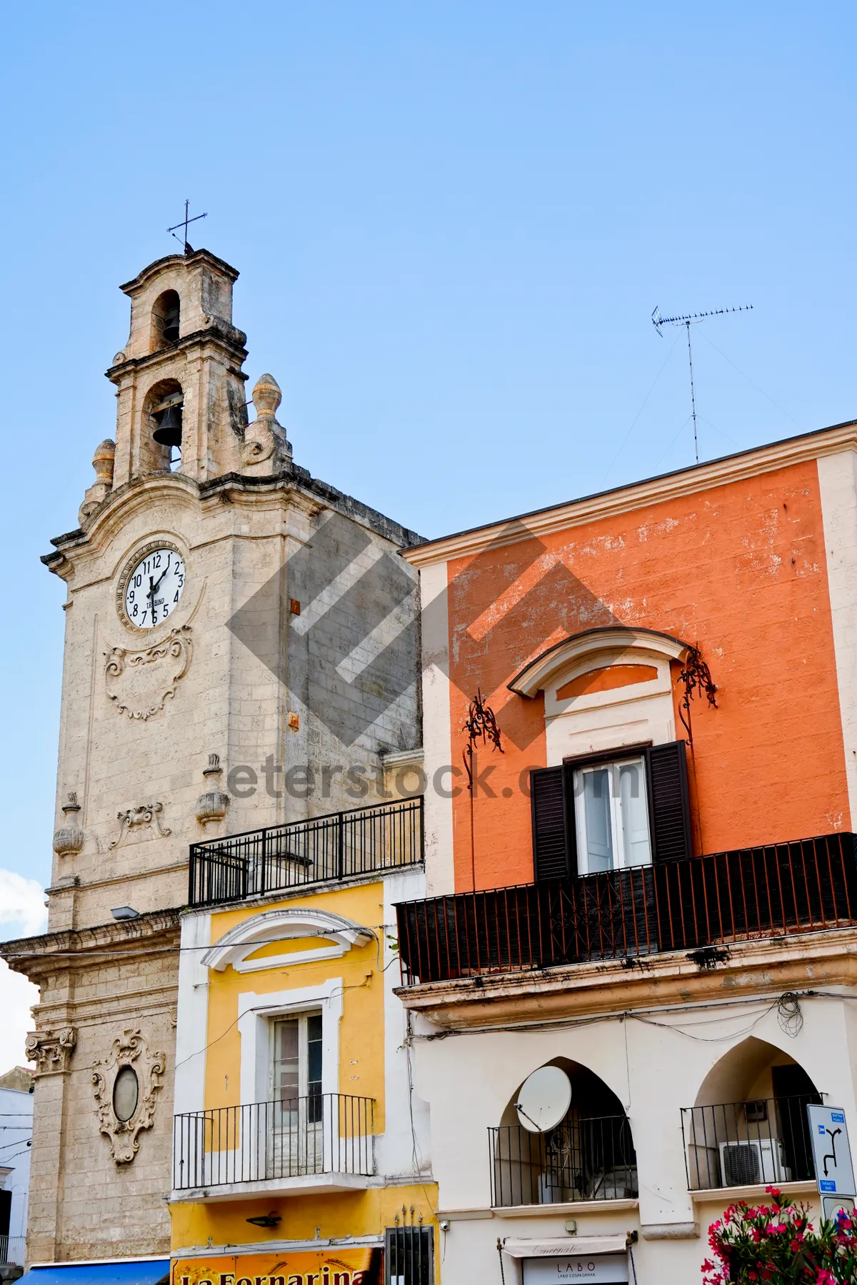 Picture of Historic cathedral tower with clock and bell.