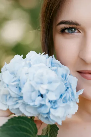 Attractive Lady with Fresh Makeup and Flower Bouquet