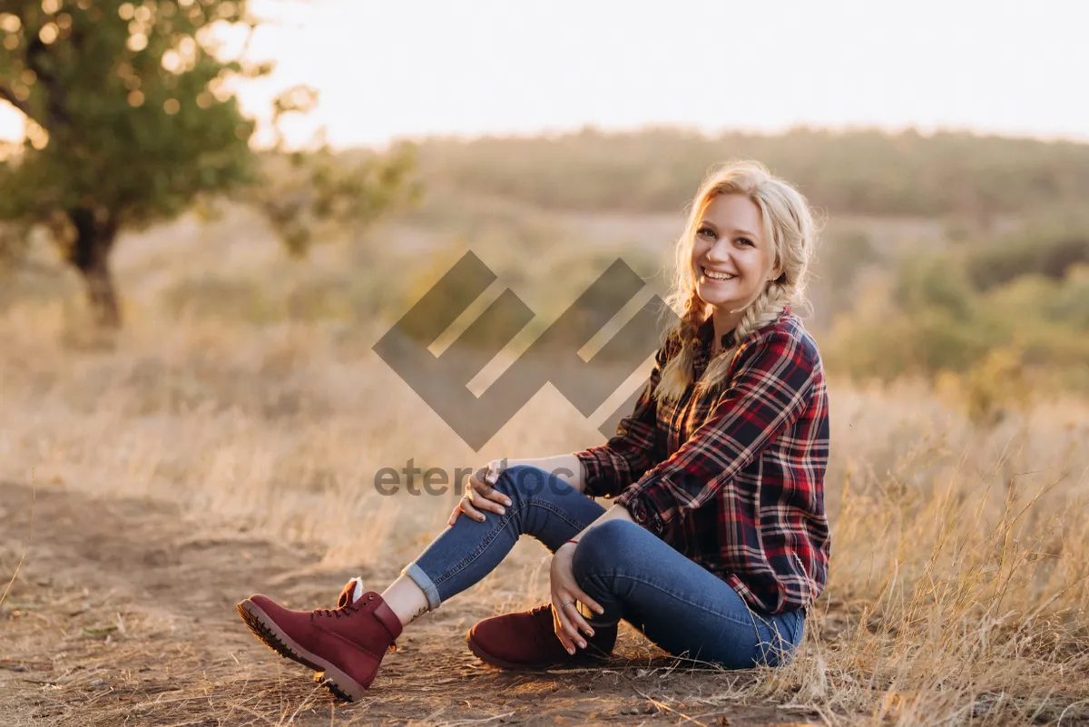 Picture of Happy woman in park wearing cowboy boots