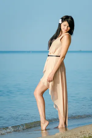 Beautiful beach day with attractive model in swimsuit