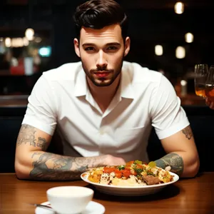 Happy couple enjoying meal at restaurant table