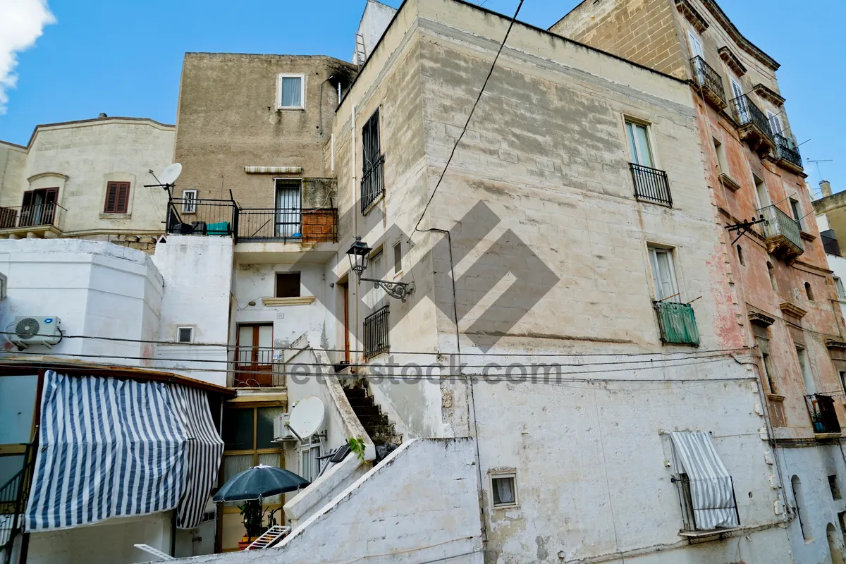 Picture of Medieval tower in historic village with ancient architecture.