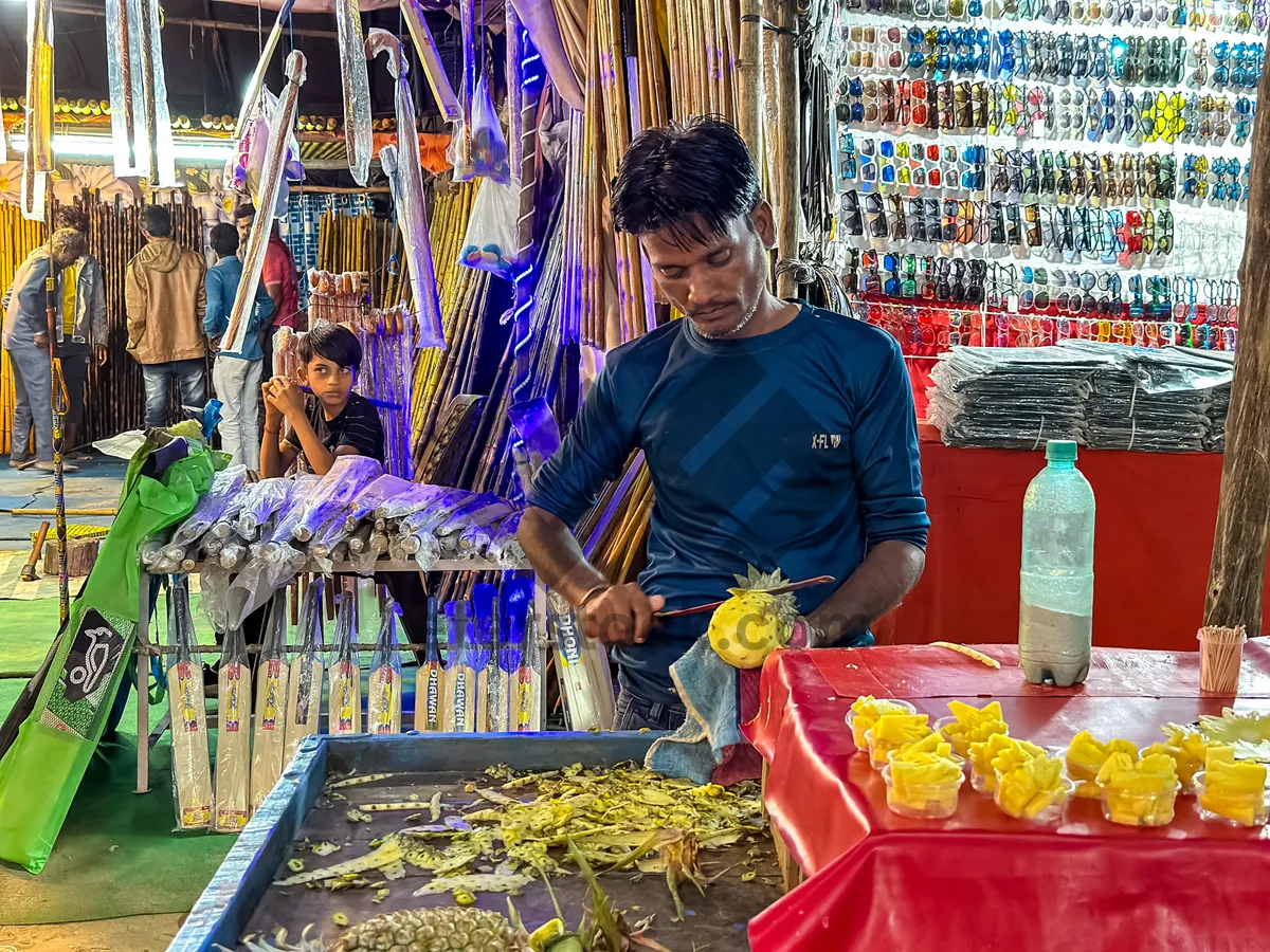 Picture of Fan seller at market stall