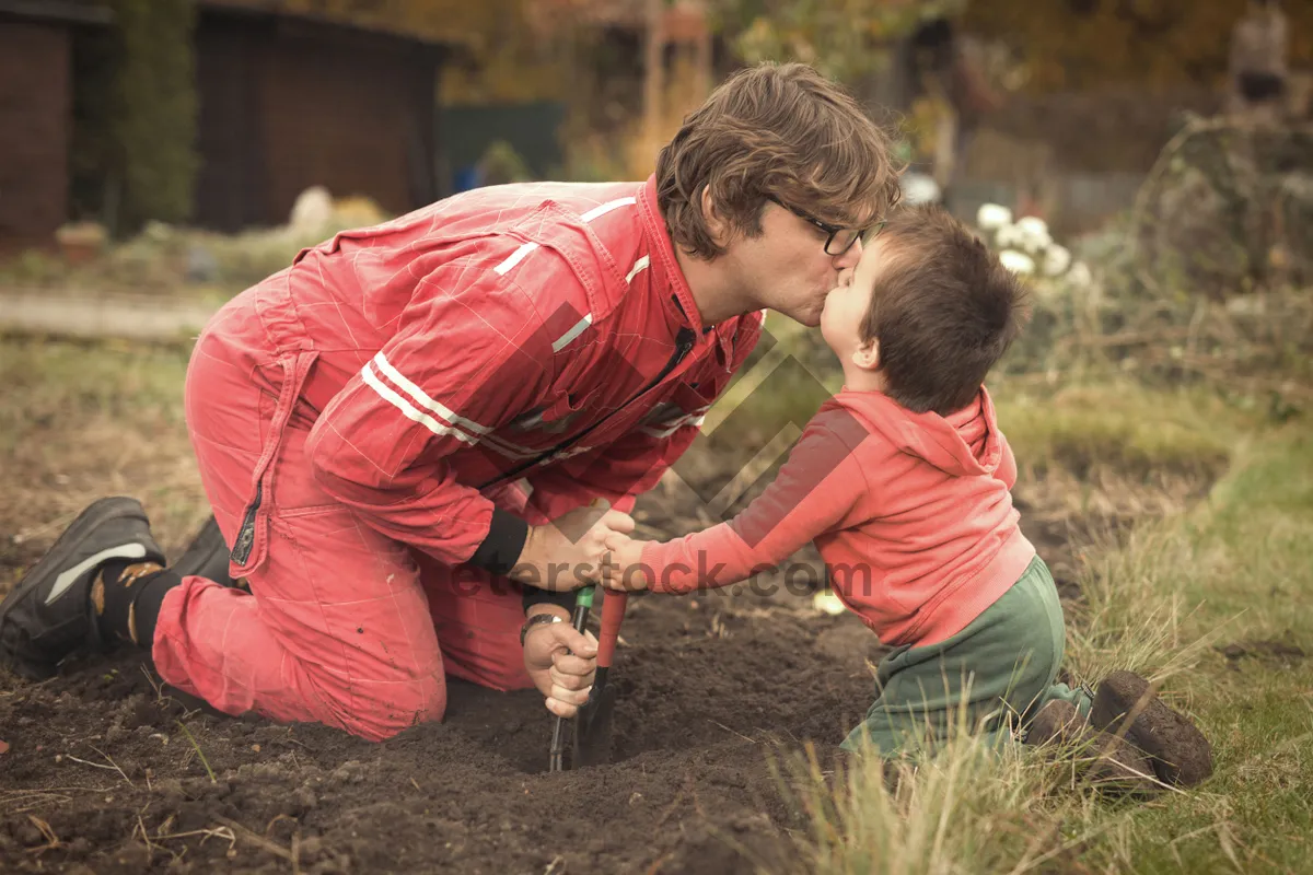 Picture of Happy Father and Son Smiling in Park