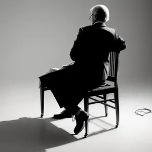 Silhouette of a Man Sitting on Rocking Chair