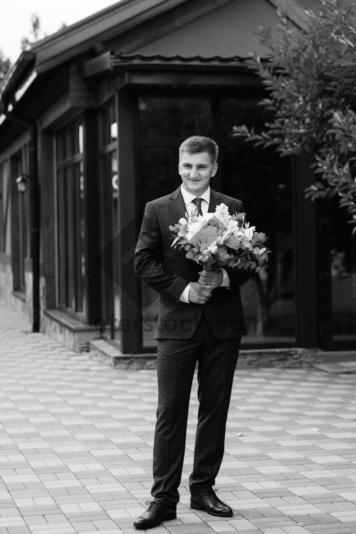 Picture of Happy newlywed couple with brass instruments at wedding.