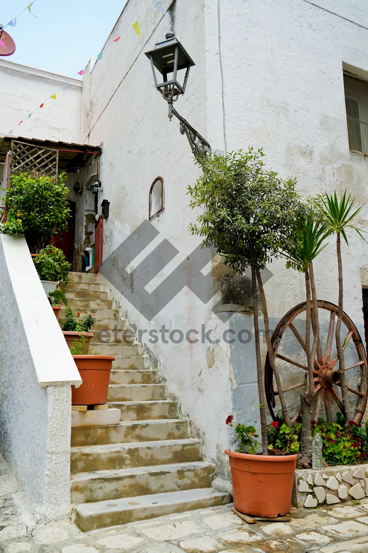 Picture of Old House With Picket Fence and Flowers