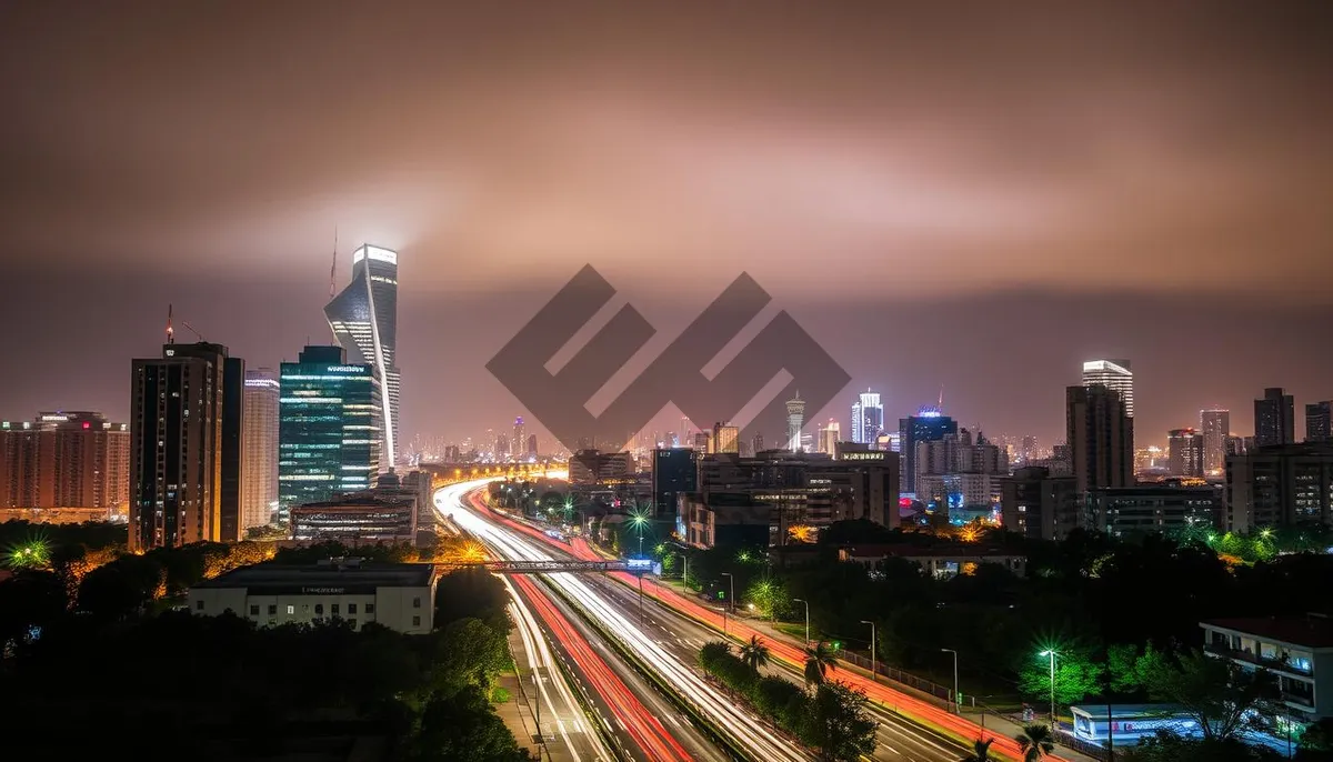 Picture of Modern Business Tower at Night overlooking City River.