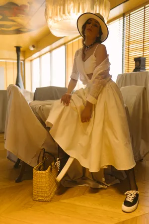 Happy bride in white wedding gown with bouquet