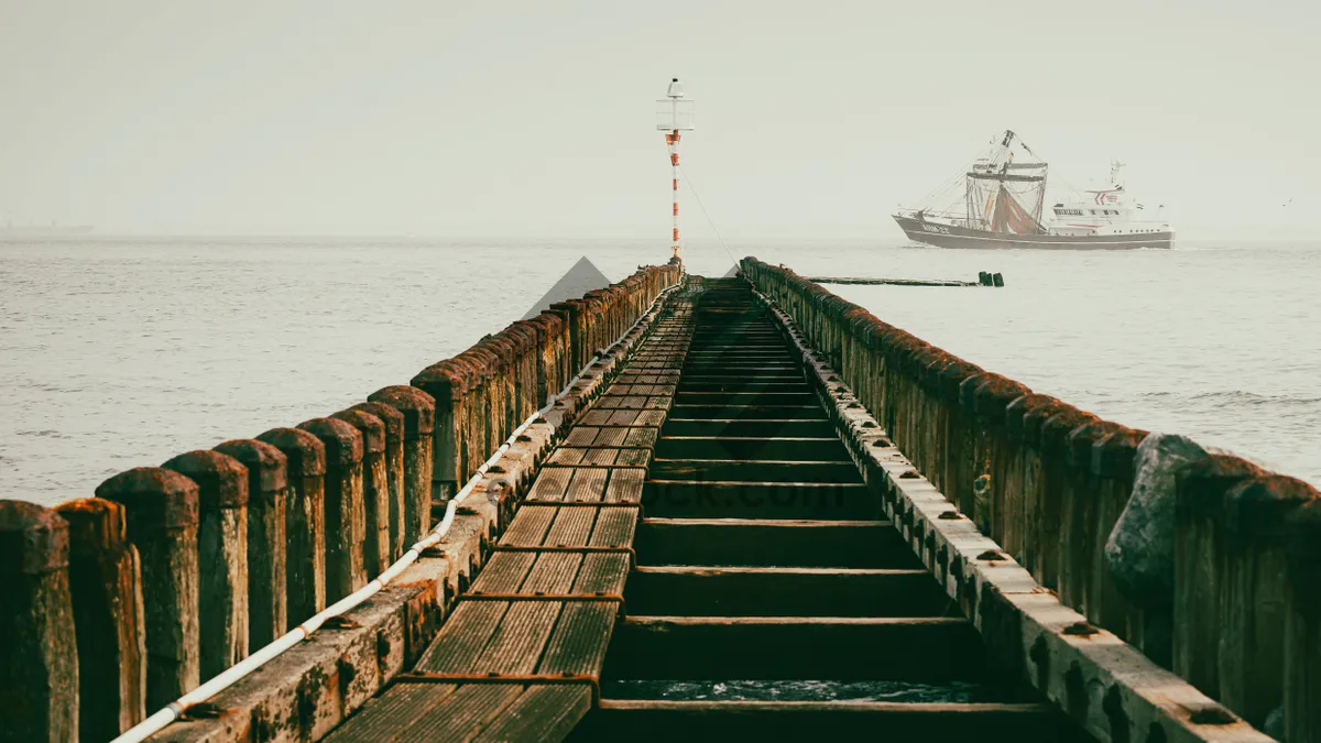 Picture of Skyline view of coastal bridge with clouds