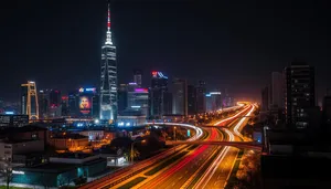 Modern city skyline at night with light trails