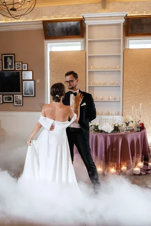 Happy couple at wedding ceremony with flower bouquet