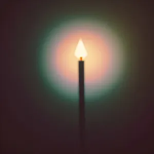 Flaming Candle Illuminating Dark Celebration