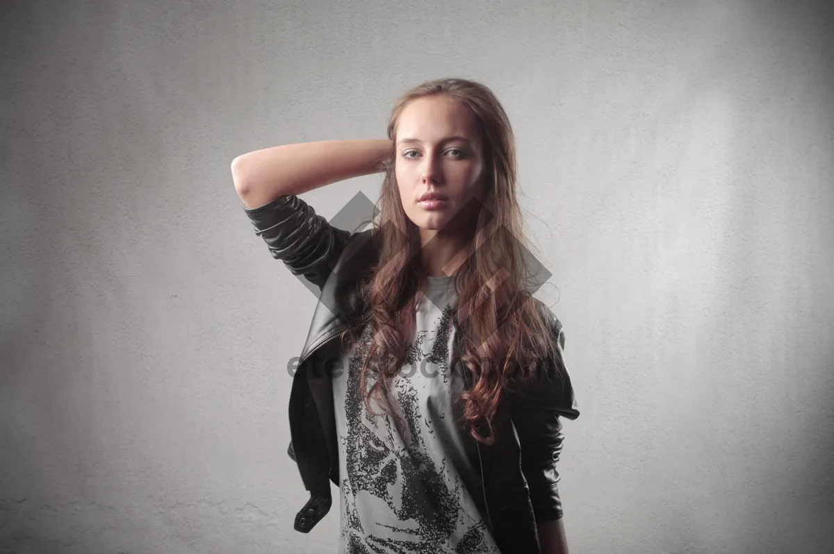 Picture of Attractive brunette fashion model posing in studio portrait.