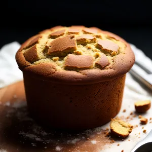 Freshly baked chocolate muffin with a cup of coffee.