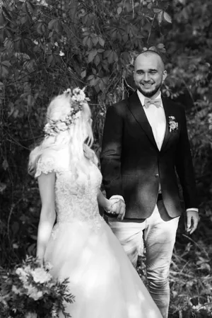 Smiling groom and bride at park wedding portrait.