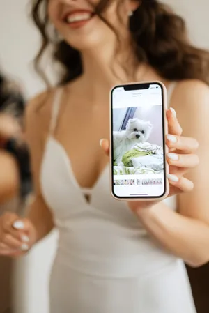 Happy person holding a camera - lifestyle portrait.