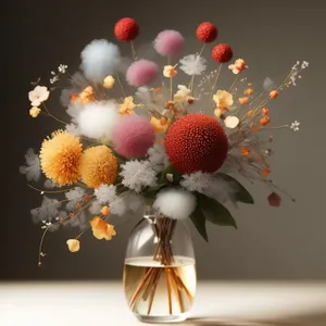 Bright holiday chandelier decoration with flowering shrub.